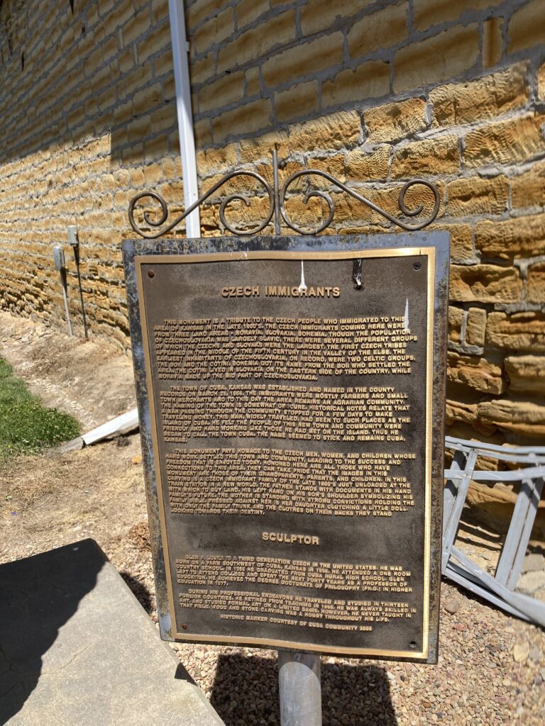 Cuba, Kansas historical plaque detailing the town's founding in 1868, Czech heritage, and relocation to the railroad line in 1884.