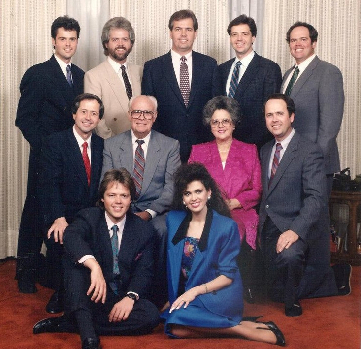 The Osmond family posing together — 11 members including parents George and Olive Osmond, daughter Marie, and all the Osmond brothers