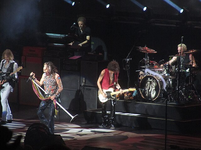 Aerosmith performing live on stage with full band