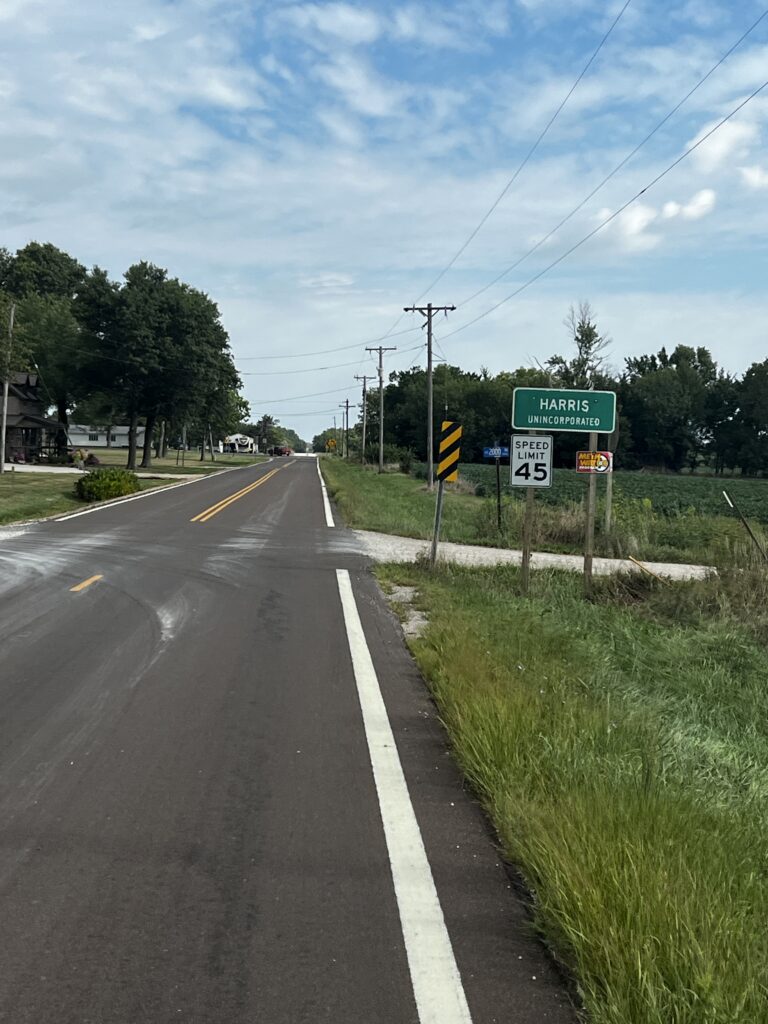 Sign for Harris, Kansas, marking the entrance to the town. Title: Rolling into Harris, Kansas