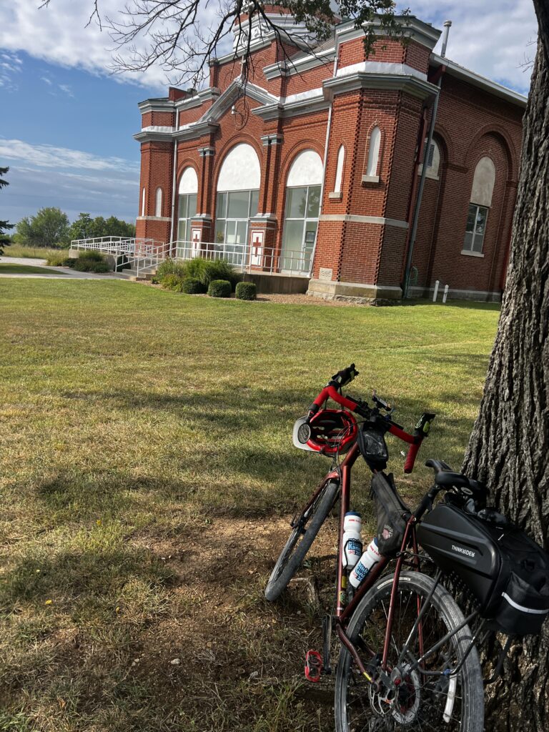 A picturesque view of Sacred Heart Catholic Church atop a hill in Newbury, Kansas.