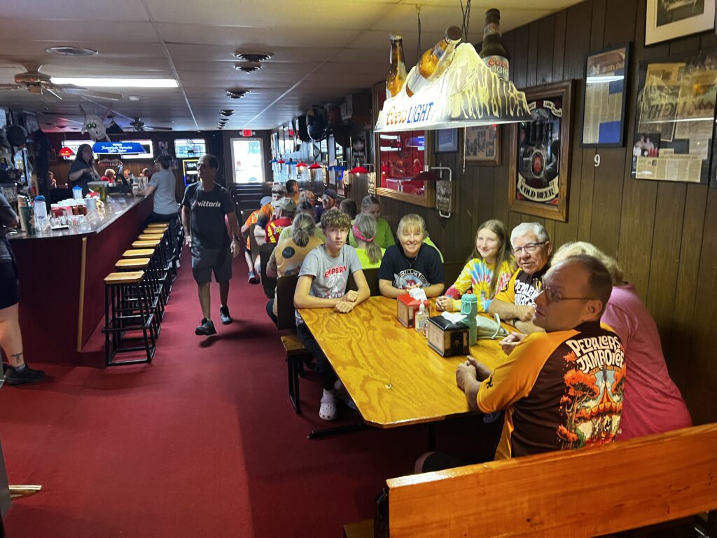 Friends gathered inside Guy & Mae’s Tavern in Williamsburg, Kansas, ordering their meals and enjoying each other’s company after a morning ride.