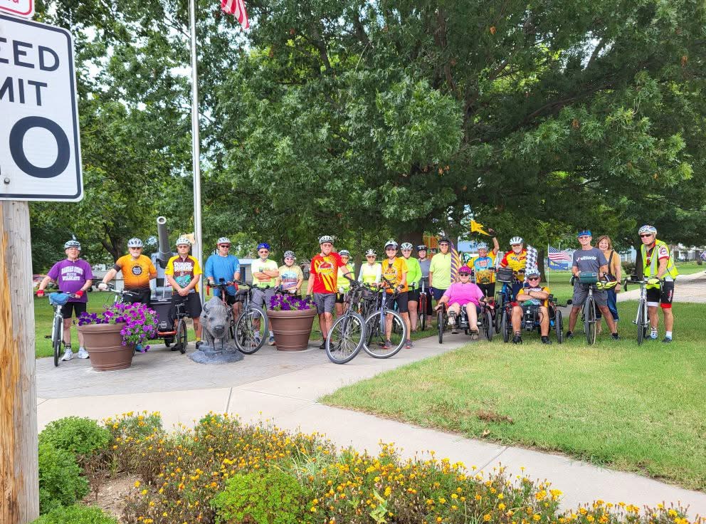 Group of 30 bicyclists posing in the park at Williamsburg, Kansas – Rib Ride 2025