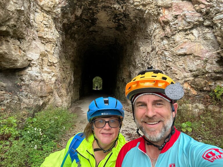 Cyclists Larbe and Tammy standing at the Rocheport Tunnel on the Katy Trail 2025, ready to continue their ride.