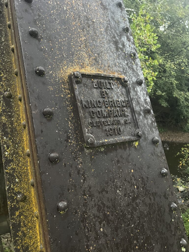 Close-up of a bridge plaque on the Katy Trail showing the year 1910.
