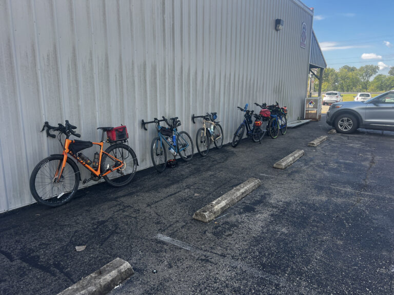 Bicycles lined up along the side of a grocery store near Hermann, Missouri, on the Hermann Spur – captured on a ShauneNation ride