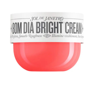 Jar of Sol de Janeiro Bom Dia AHA Body Cream on a bathroom counter with soft natural light, showing label and creamy texture.