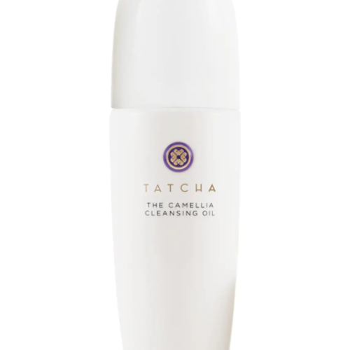 A bottle of Tatcha One Step Camellia Cleansing Oil on a clean bathroom counter, luxury skincare product that removes makeup and nourishes skin.